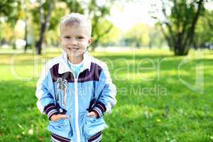 Little boy in summer park