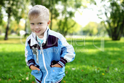 Little boy in summer park