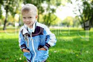 Little boy in summer park