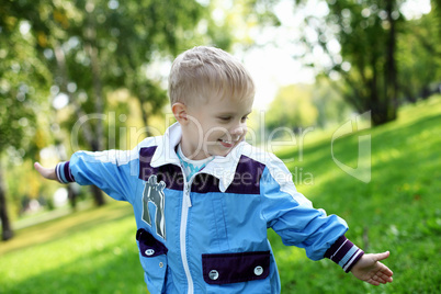 Little boy in summer park