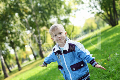 Little boy in summer park