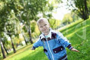 Little boy in summer park