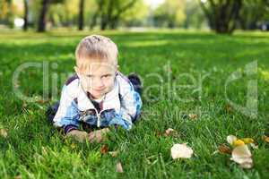 Little boy in summer park