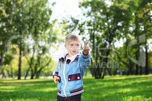 Little boy in summer park