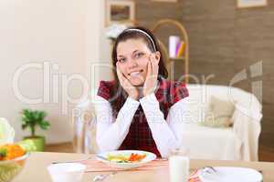 young girl eating healthy food at home