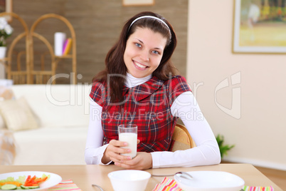 young girl eating healthy food at home