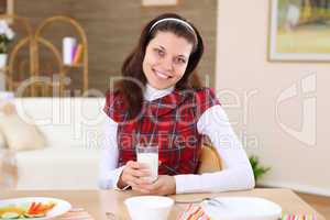 young girl eating healthy food at home