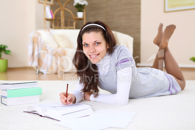 young girl at home with books