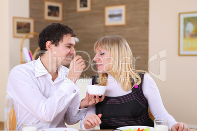 young couple at home having meal young couple at home having meal