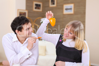 young couple at home having meal