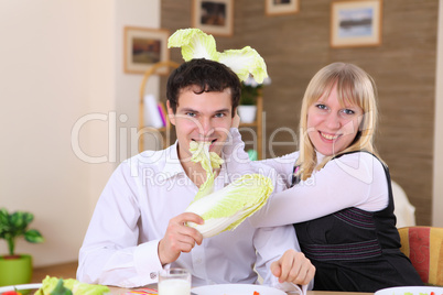 young couple at home having meal