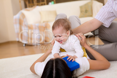 baby with a mother at home