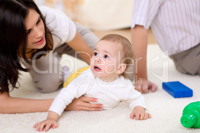 baby with a mother at home