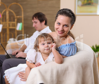 baby with a mother at home