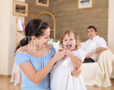 baby with a mother at home