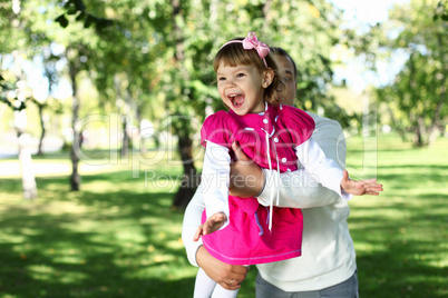 Father with daughter in summer park