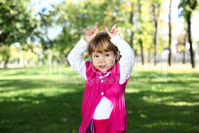 Little girl in summer park