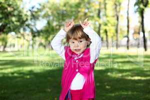 Little girl in summer park