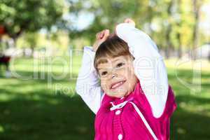 Little girl in summer park