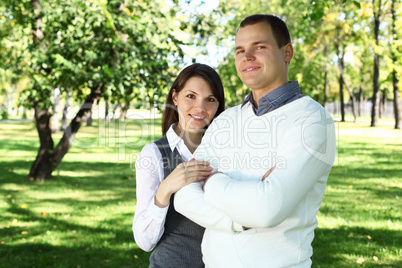 Young family with a child in summer park