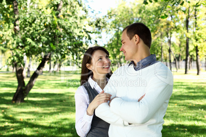 Young family with a child in summer park