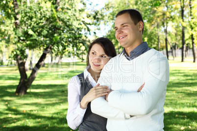 Young family with a child in summer park