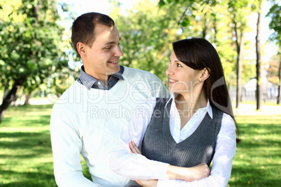 Young family with a child in summer park