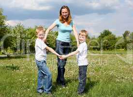 mother with her two sons outdoors