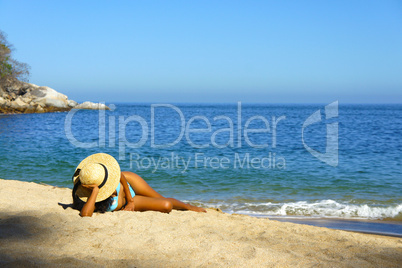 Woman lying on the beach