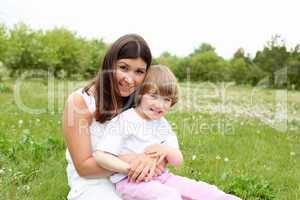 itlle girl with her mother outdoors