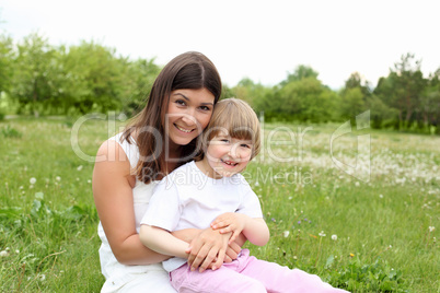 itlle girl with her mother outdoors