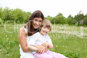 itlle girl with her mother outdoors