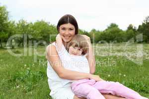 itlle girl with her mother outdoors