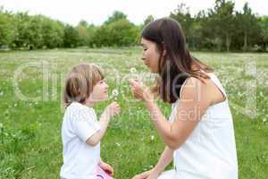 itlle girl with her mother outdoors