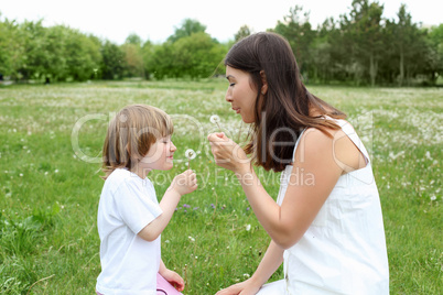 itlle girl with her mother outdoors