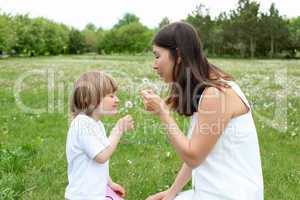 itlle girl with her mother outdoors