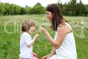 itlle girl with her mother outdoors