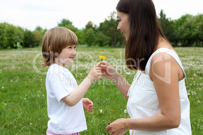 itlle girl with her mother outdoors