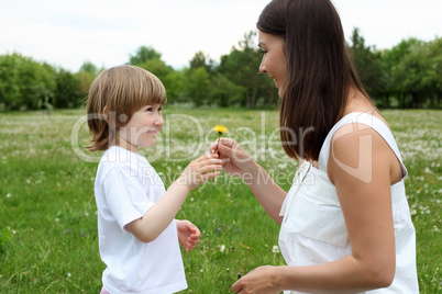 itlle girl with her mother outdoors