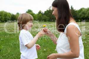 itlle girl with her mother outdoors