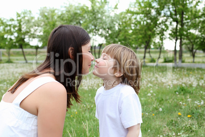 itlle girl with her mother outdoors itlle girl with her mother outdoors