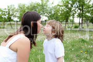 itlle girl with her mother outdoors