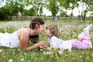 itlle girl with her mother outdoors