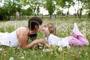 itlle girl with her mother outdoors