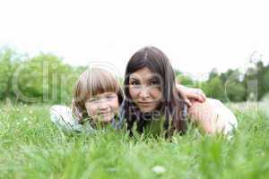 itlle girl with her mother outdoors