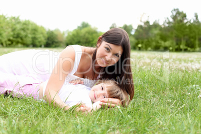 itlle girl with her mother outdoors