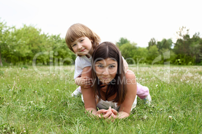 itlle girl with her mother outdoors