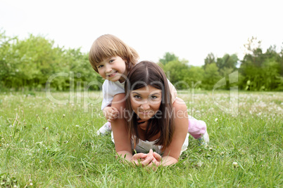 itlle girl with her mother outdoors