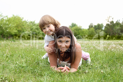itlle girl with her mother outdoors