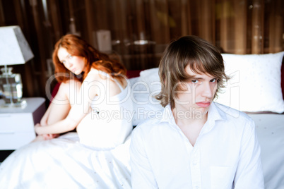 couple in disagreement in bedroom